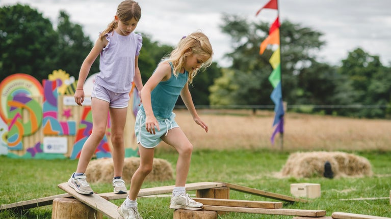Children playing on balance equipment at Killerton